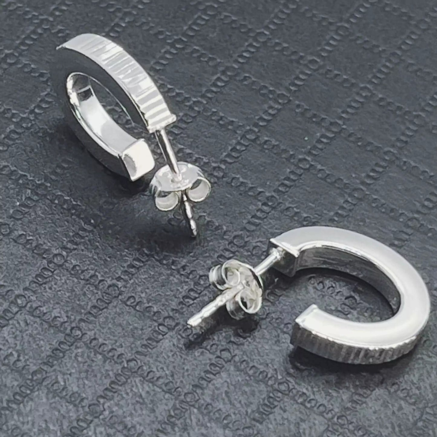 Stunning Ribbed Lobe Stud Hoop Sterling Silver 925 Earrings on texture black surface