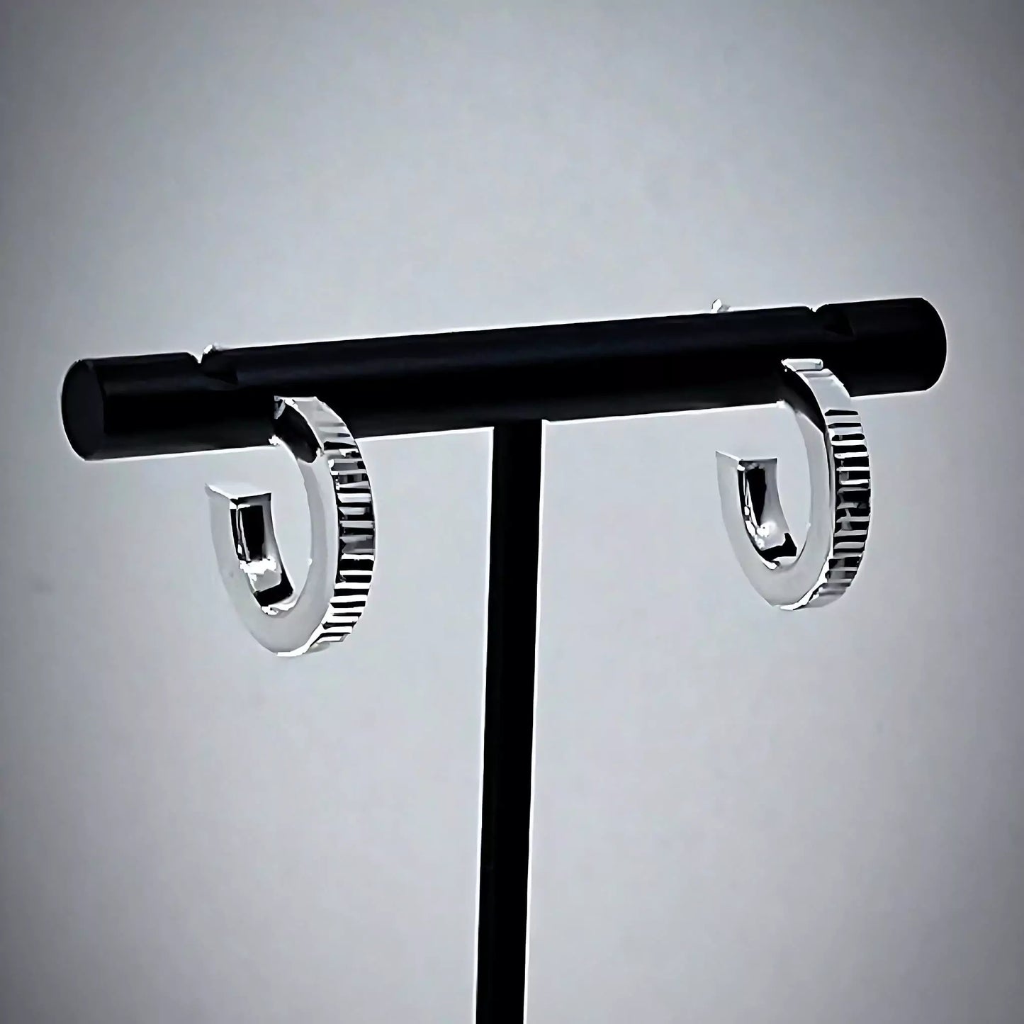 Stunning Ribbed Lobe Stud Hoop Sterling Silver 925 Earrings on T-bar stand with gray background