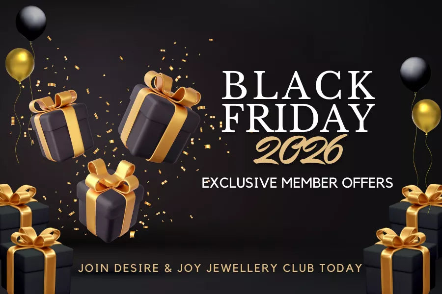 Black Friday 2026 promotional banner featuring black gift boxes, gold ribbons, balloons, and confetti on a dark background, highlighting exclusive member offers for Desire & Joy Jewellery.