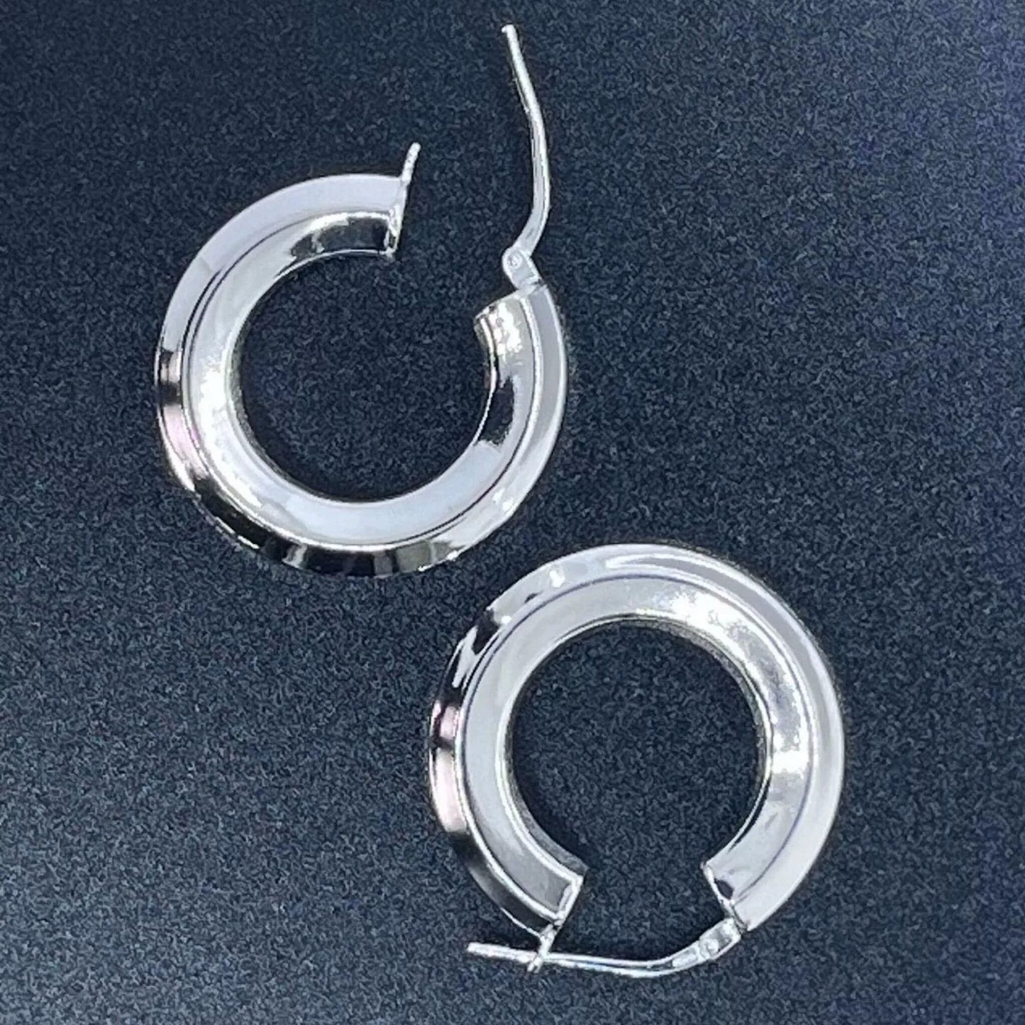 Chunky Sterling Silver 925 Hoop Earrings tube-shape Hexagon placed on a black background.