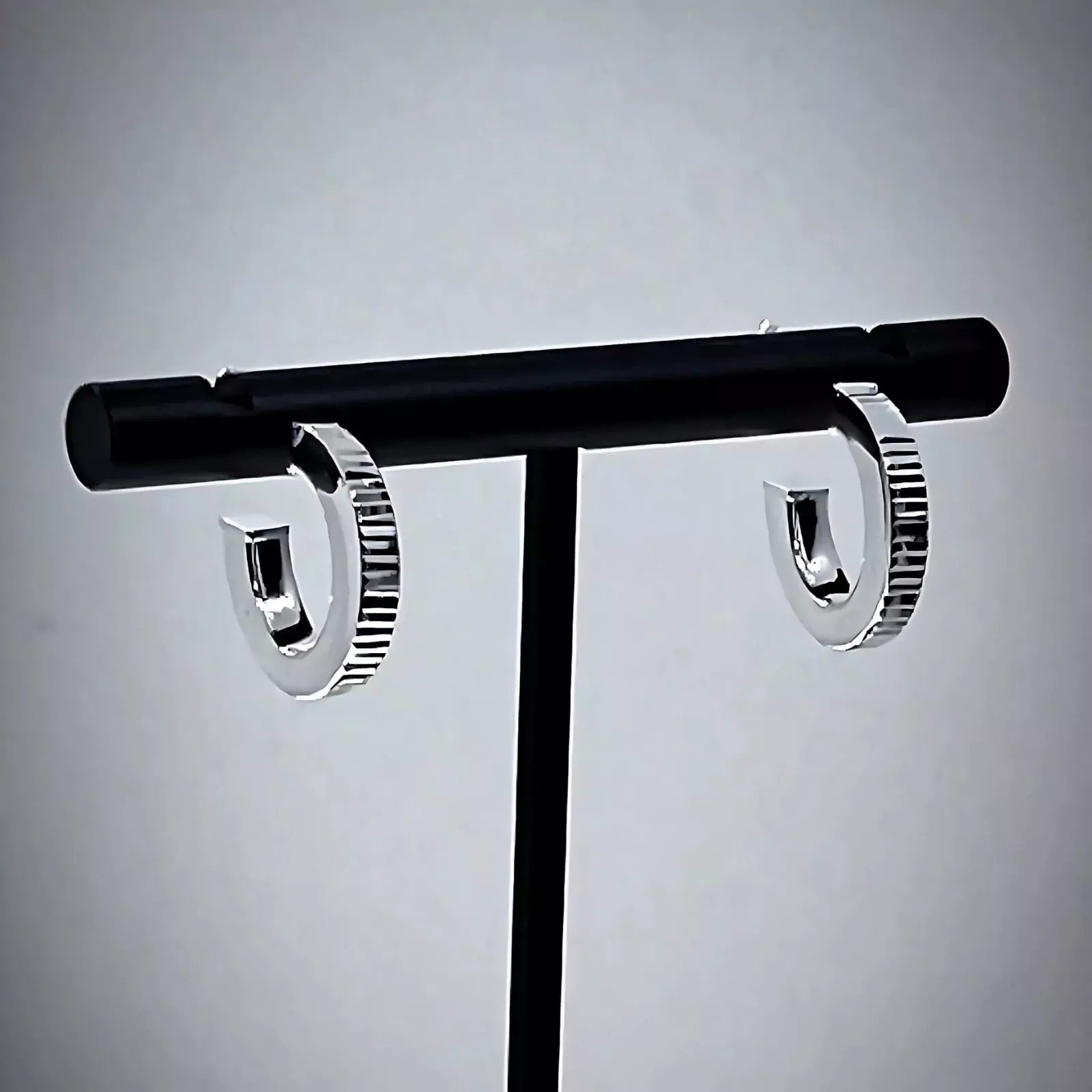 Lobe Hoop earrings crafted in Sterling Silver 925 on black t-bar stand.