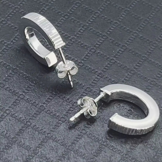 Stunning Ribbed Lobe Hoop Sterling Silver 925 Earrings on textured black surface.