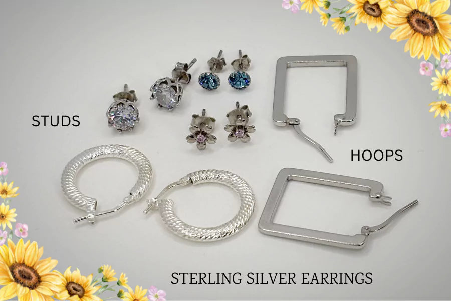 Collection of sterling silver earrings including studs and hoops on a light gray background with sunflower decorations.